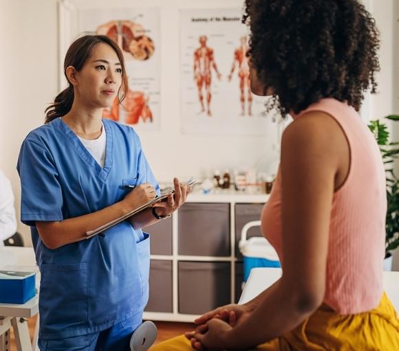 Image of physician speaking with inpatient psychiatry patient